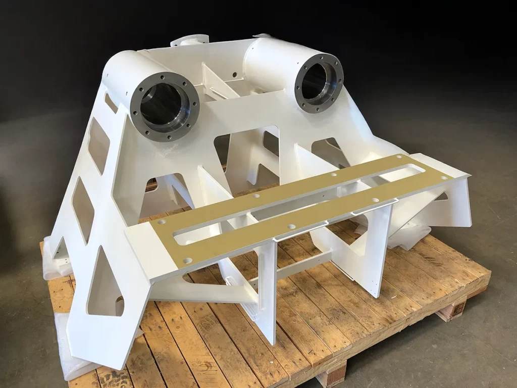 Welded machine frame with machining